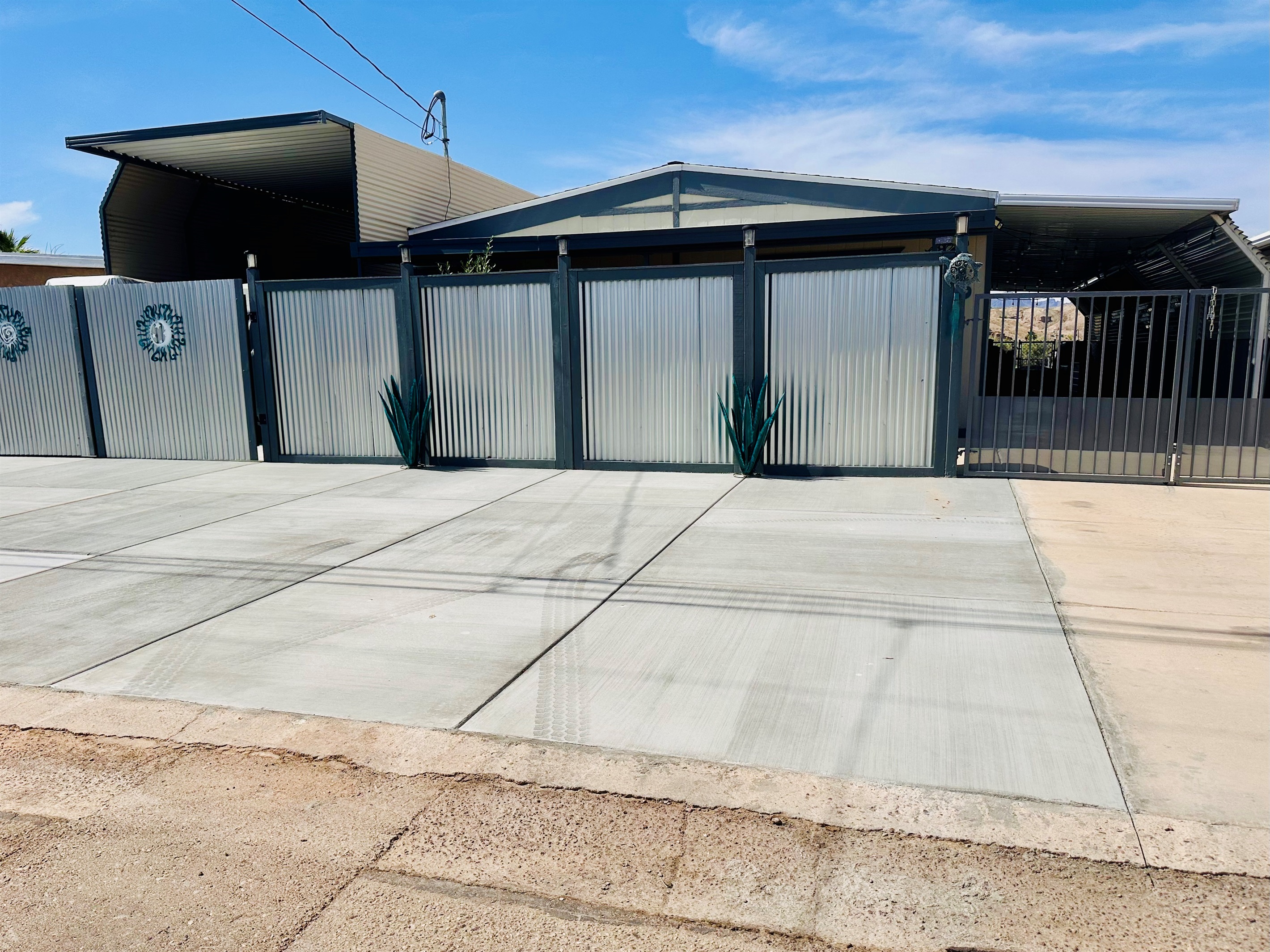 Front Yard - 3 car parking, plus two small cars in carport area