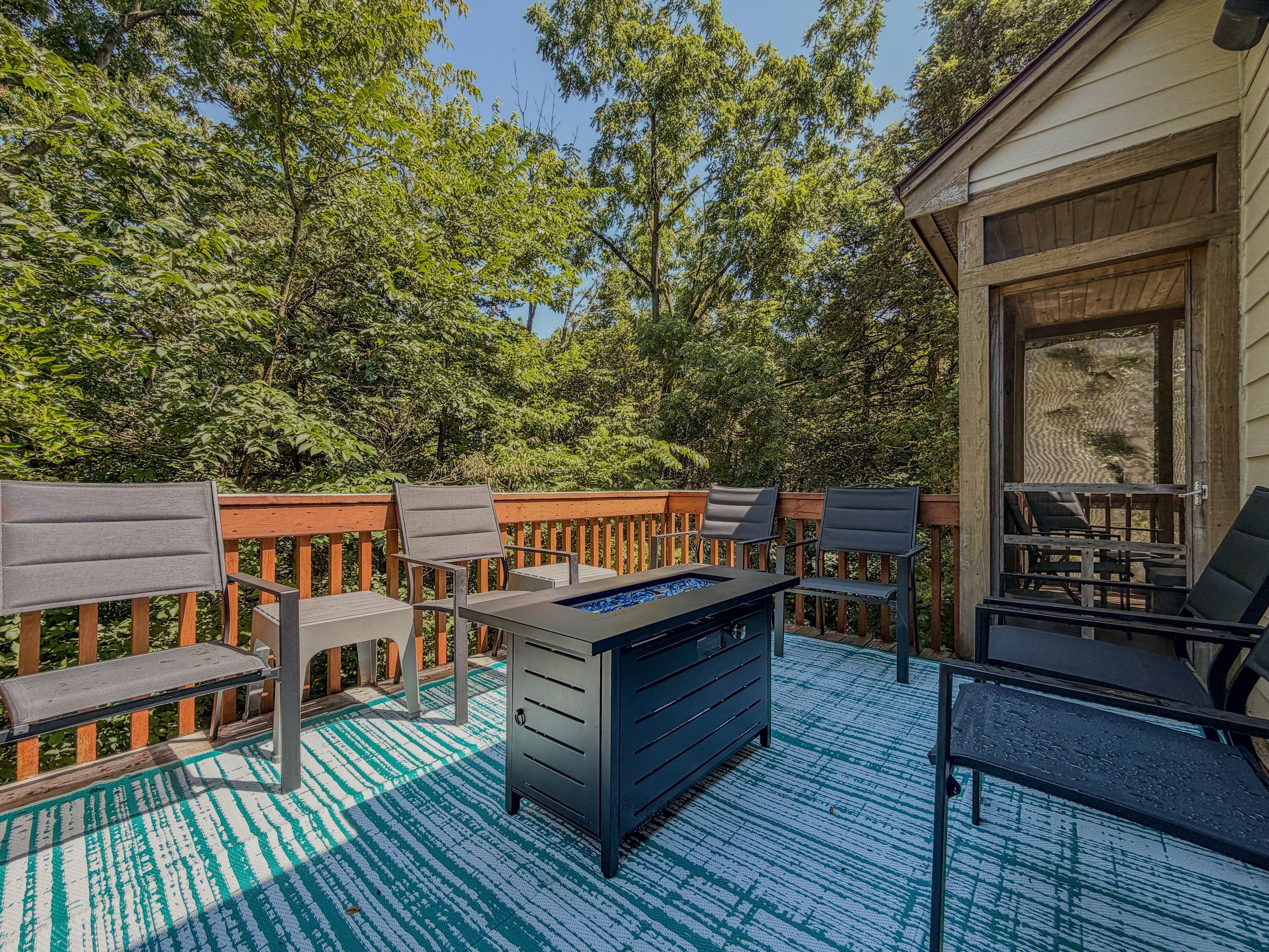 Enjoy the outdoors on the large deck -- warm up on cool nights with the firepit table. 