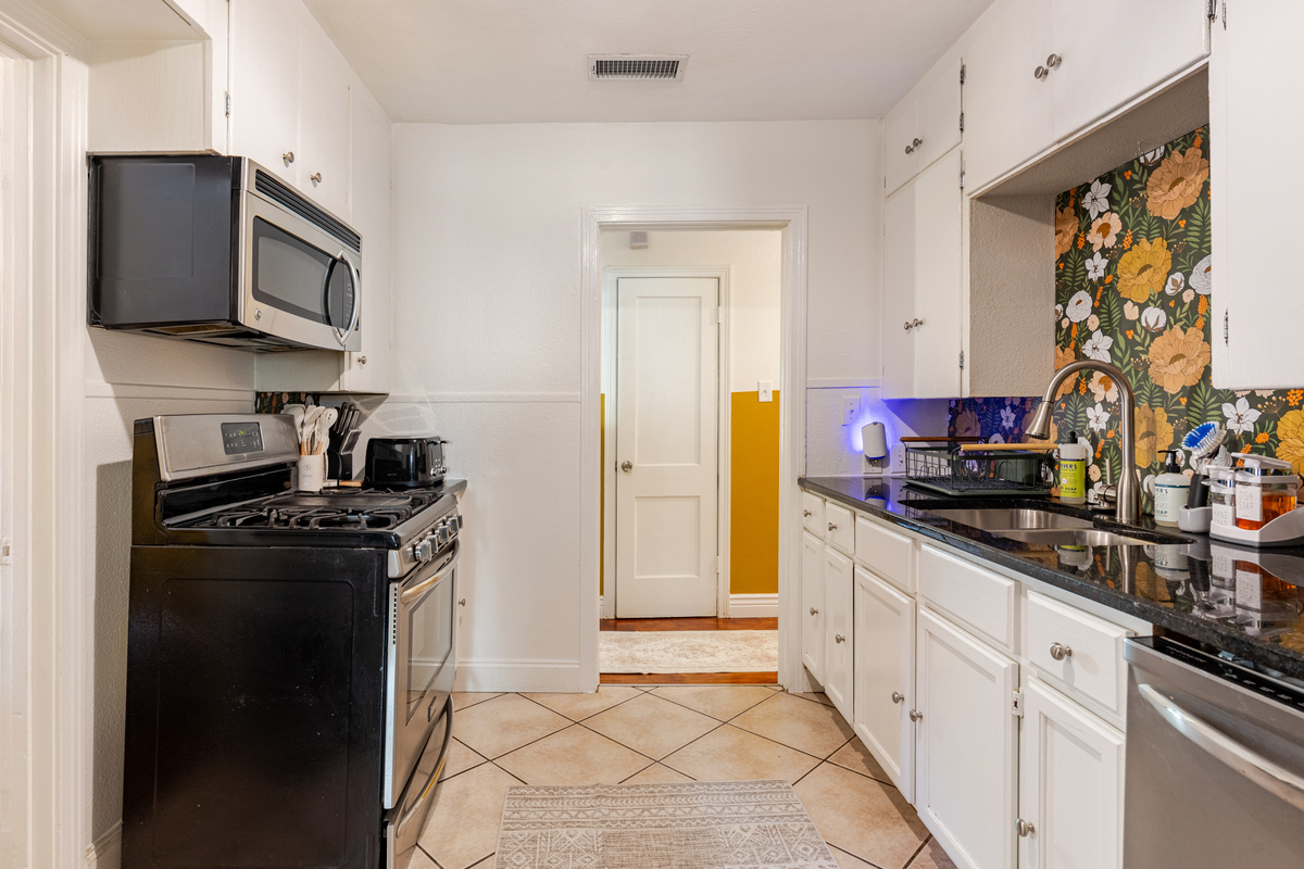 Bright floral accents and modern appliances await your culinary adventures!