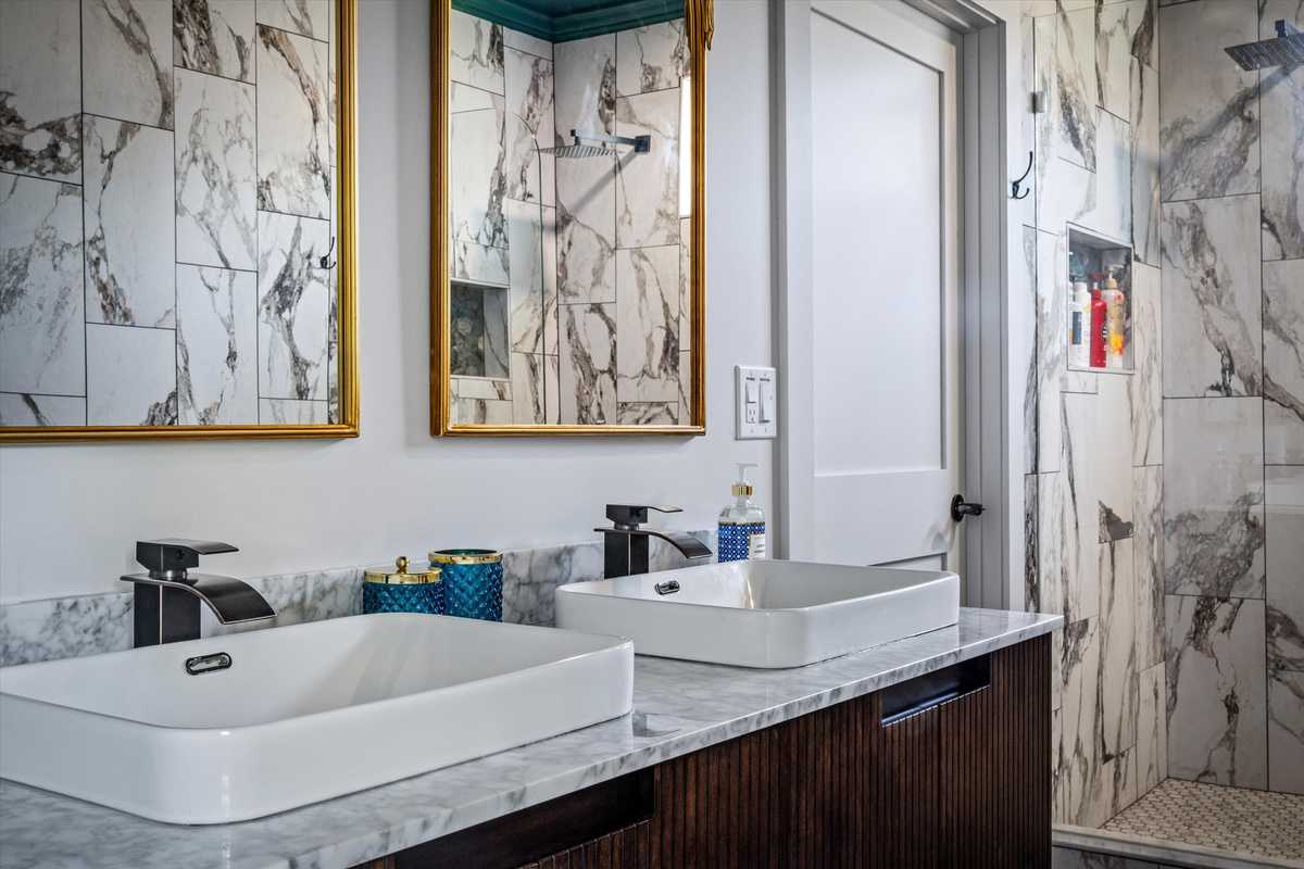Get ready in the marble bath guests keep calling "incredible" — it really is something.