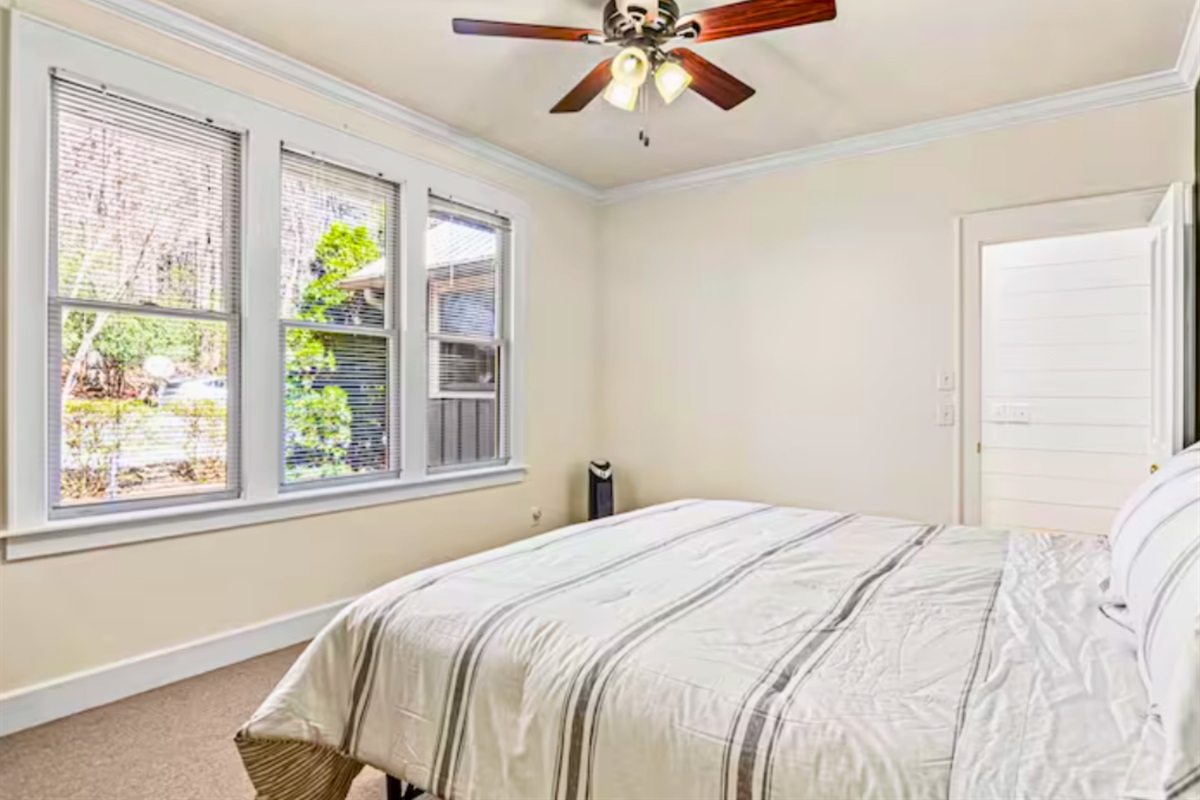 The Room Has a Cozy Queen Size Bed Plus a Portable Heater and Ceiling Fan for your Comfort