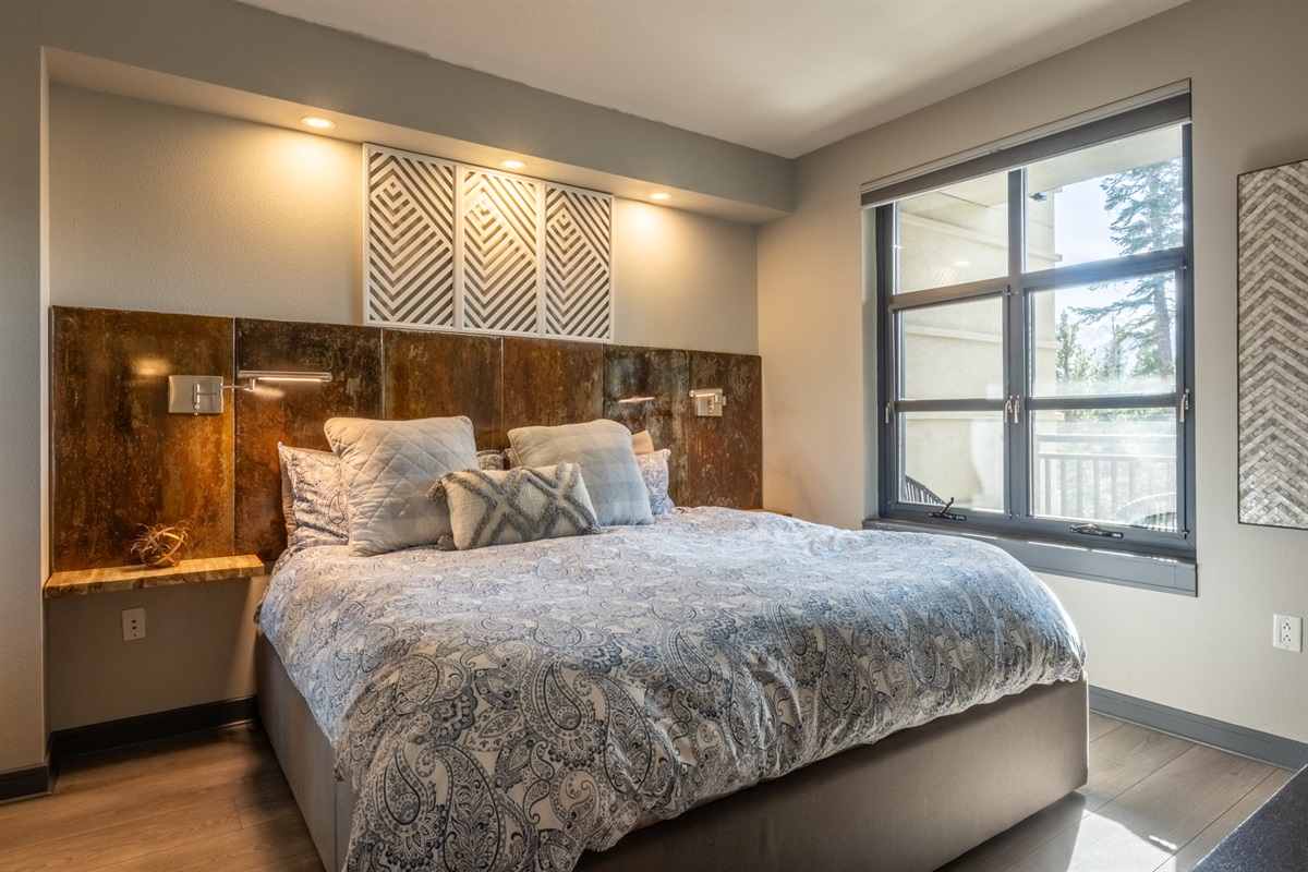 The serene king bedroom includes custom detailing and soft natural light.