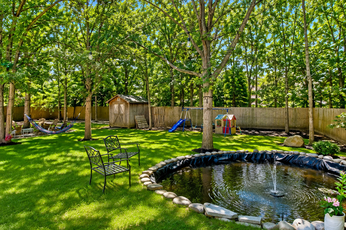 Tranquil backyard pond with fountain
