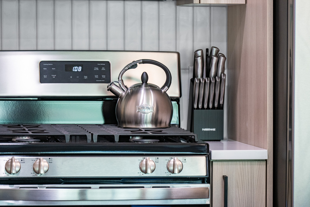 Gas range and quality cookware make meal preparation a breeze.
