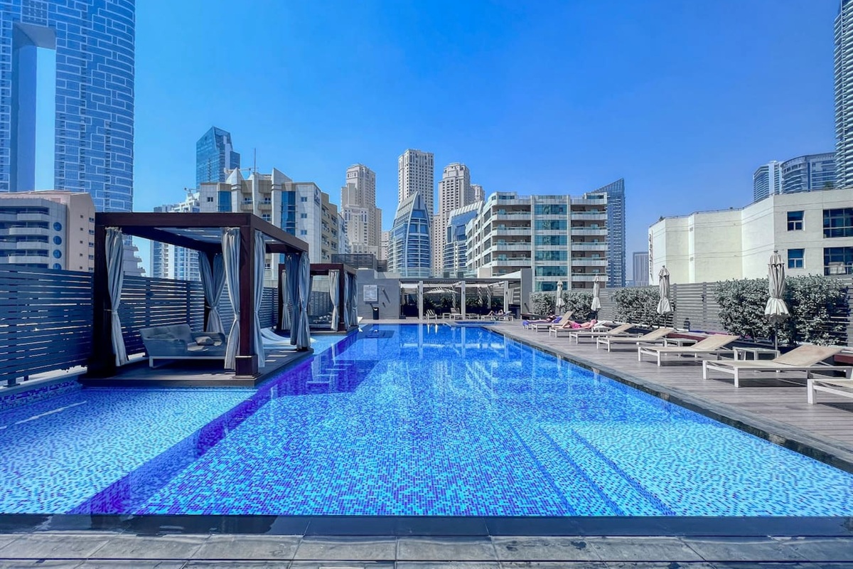 Stunning swimming pool with temperature controlled water, Jacuzzi, sunbeds and cabanas free for guests