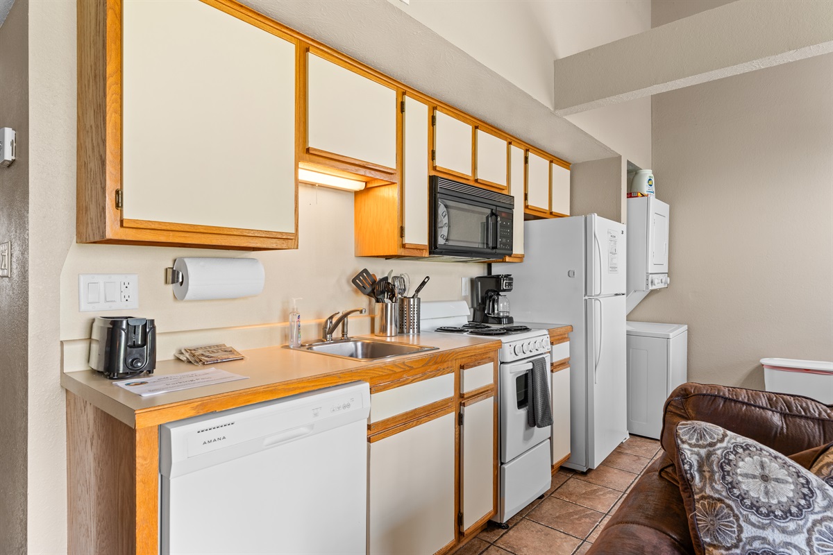 Compact and well-stocked, the kitchen keeps snacks, coffee, and simple meals easy.