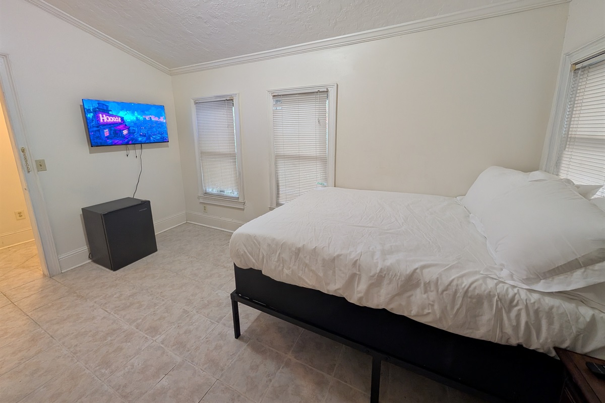 Guest bedroom downstairs with full bed