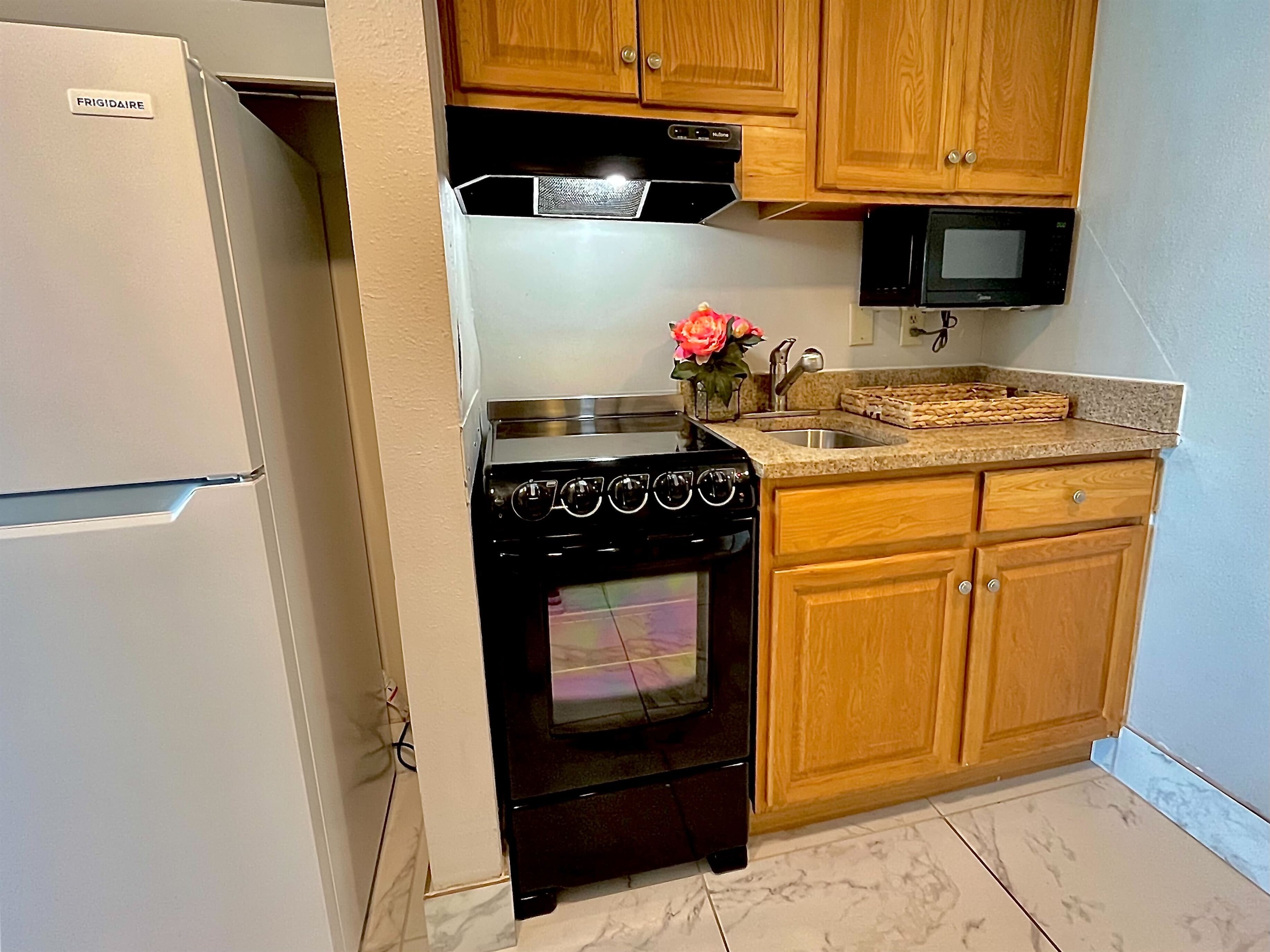 Prepare meals with ease in the convenient kitchenette, complete with all necessary appliances.