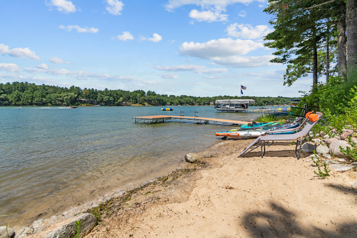 Spend your days with your toes in the sand and the peaceful lake just steps away.