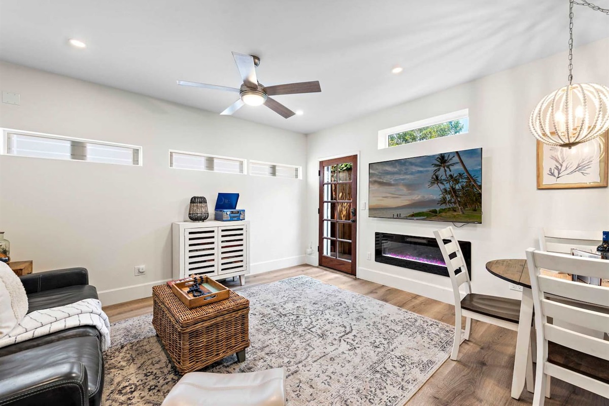 The living room has a 65" TV with multiple stream services