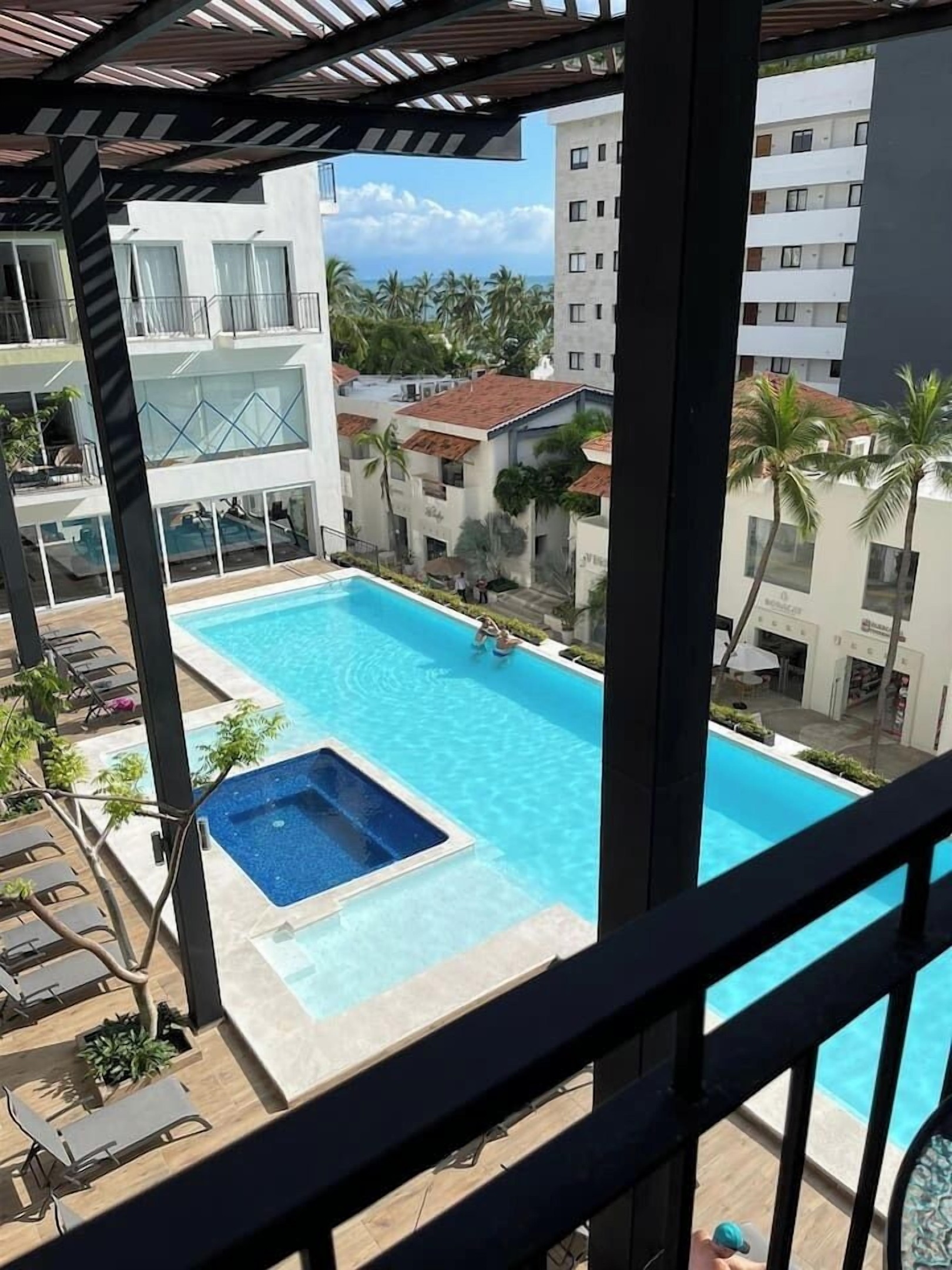 2 nd floor pool with jacuzzi and partial ocean view 322
