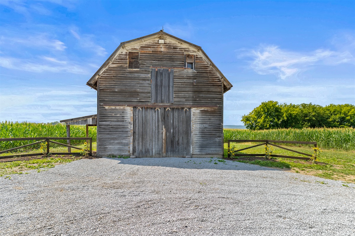 Historic character meets country living—this charming barn adds timeless appeal to the property. (Not for guest use)