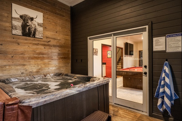 Unique indoor hot tub + game room combo — fun and relaxation in one space.