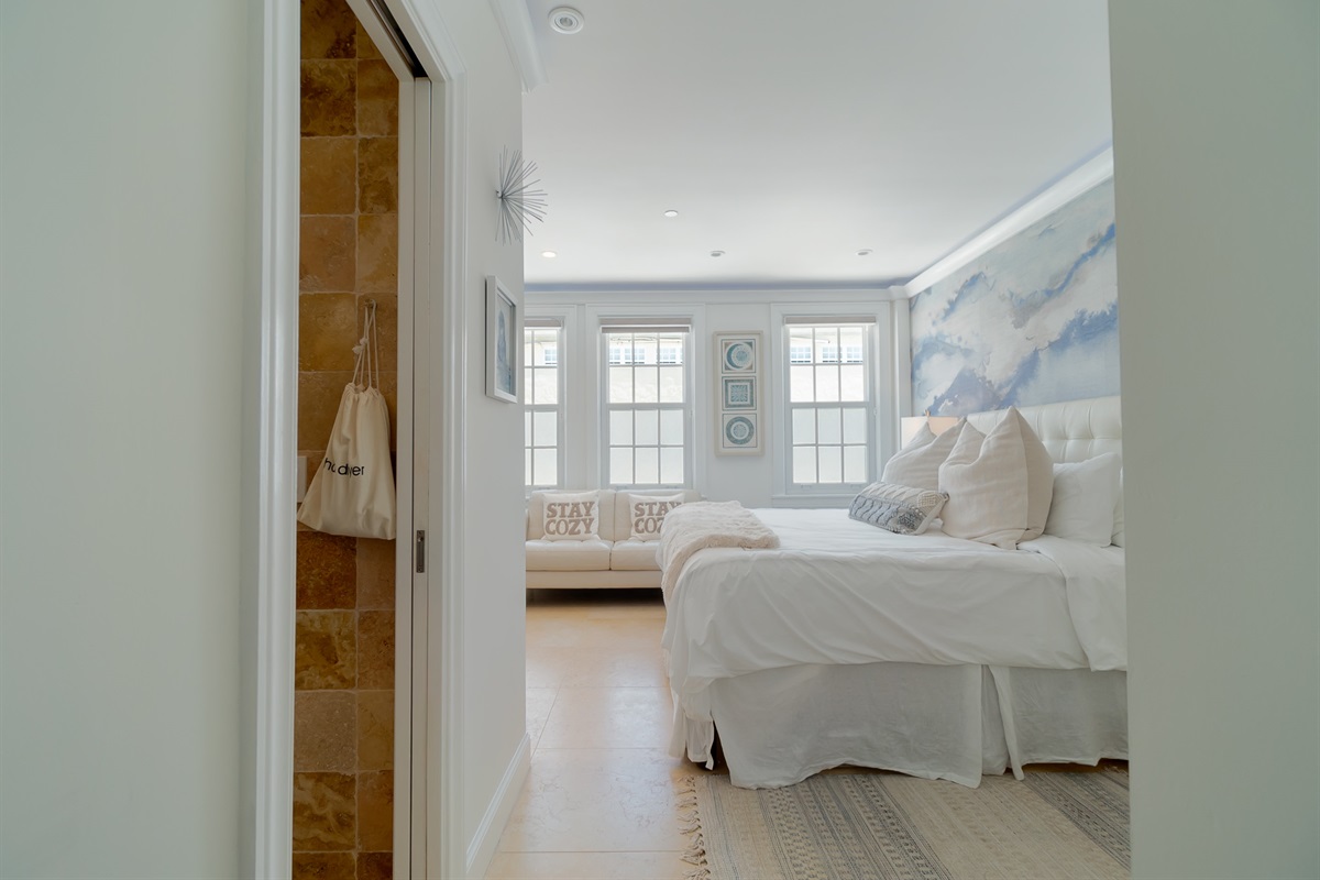 Three windows give bright sunlight as you enter your deluxe suite.