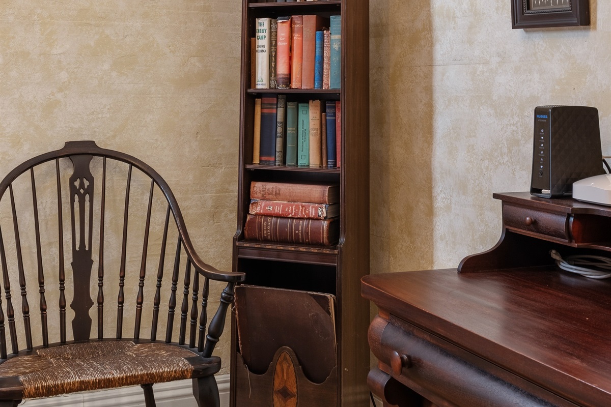 Reading nook w/ antique chairs & shelves of old books