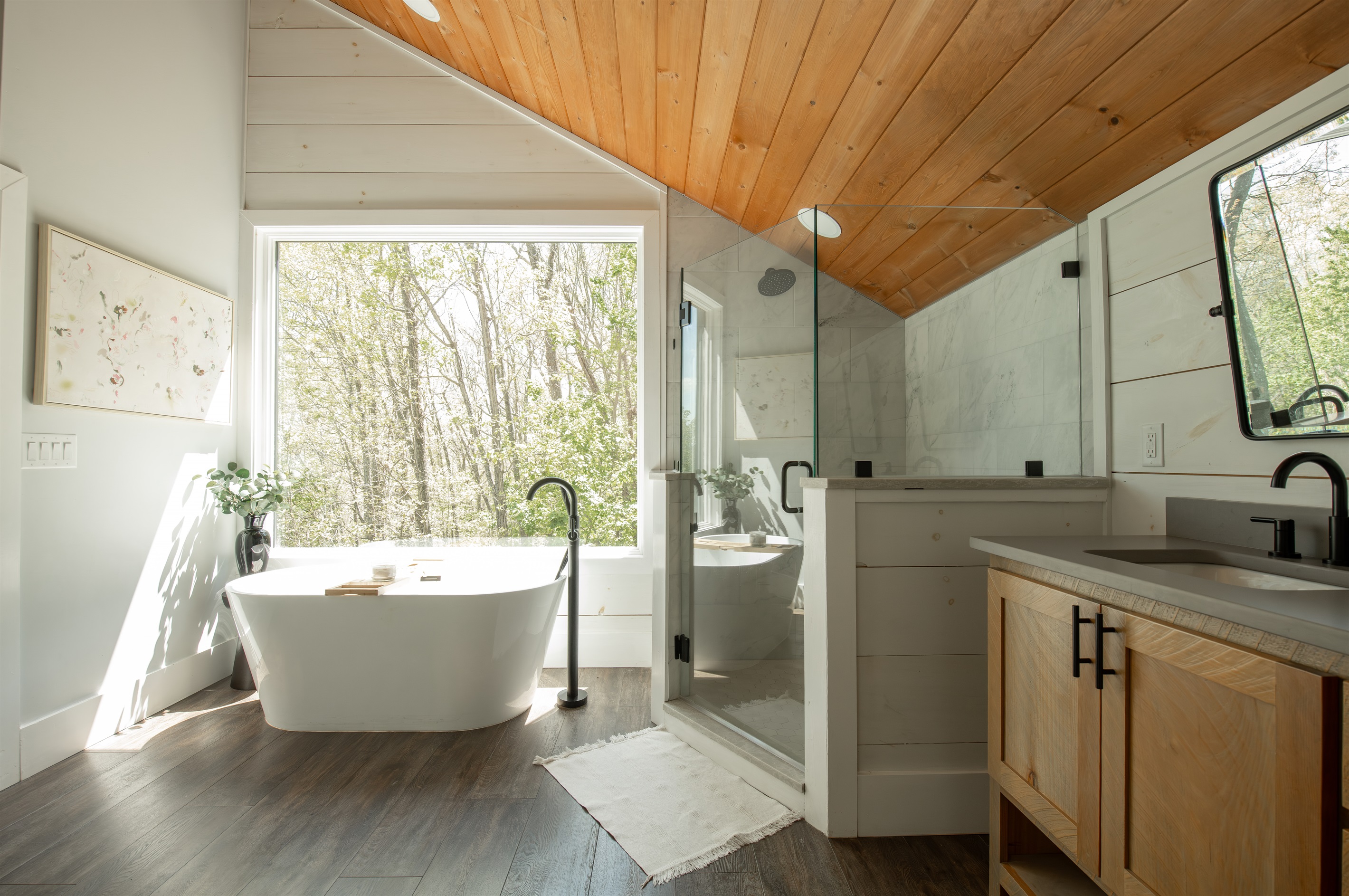 King Suite 1 Bath | Soaking tub with serene forest views 