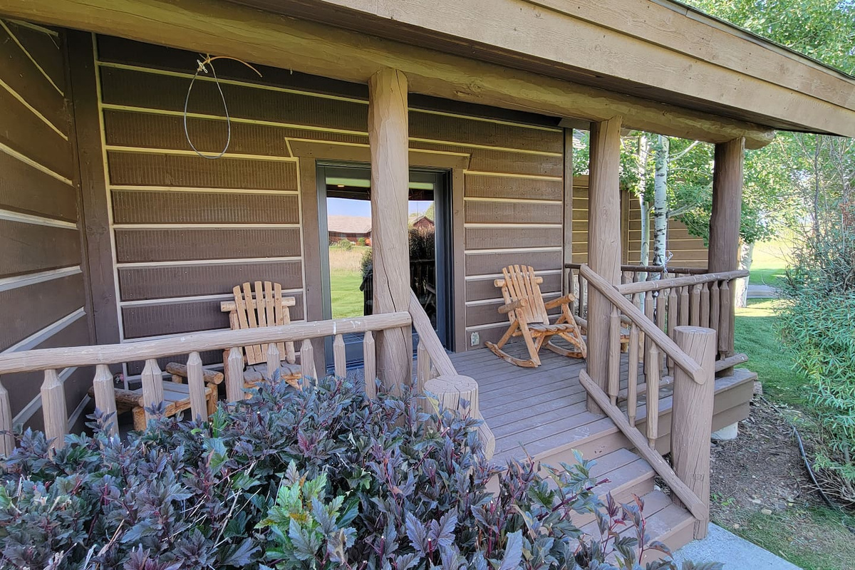 Back porch, great for watching the sunrise while drinking your coffee!  Weber grill is available for outdoor cooking. 