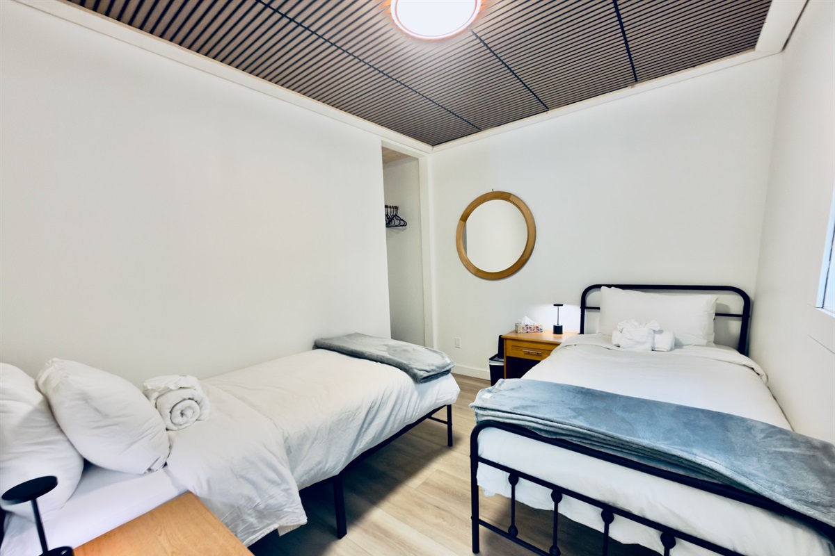 Second view of bedroom with two twin beds
