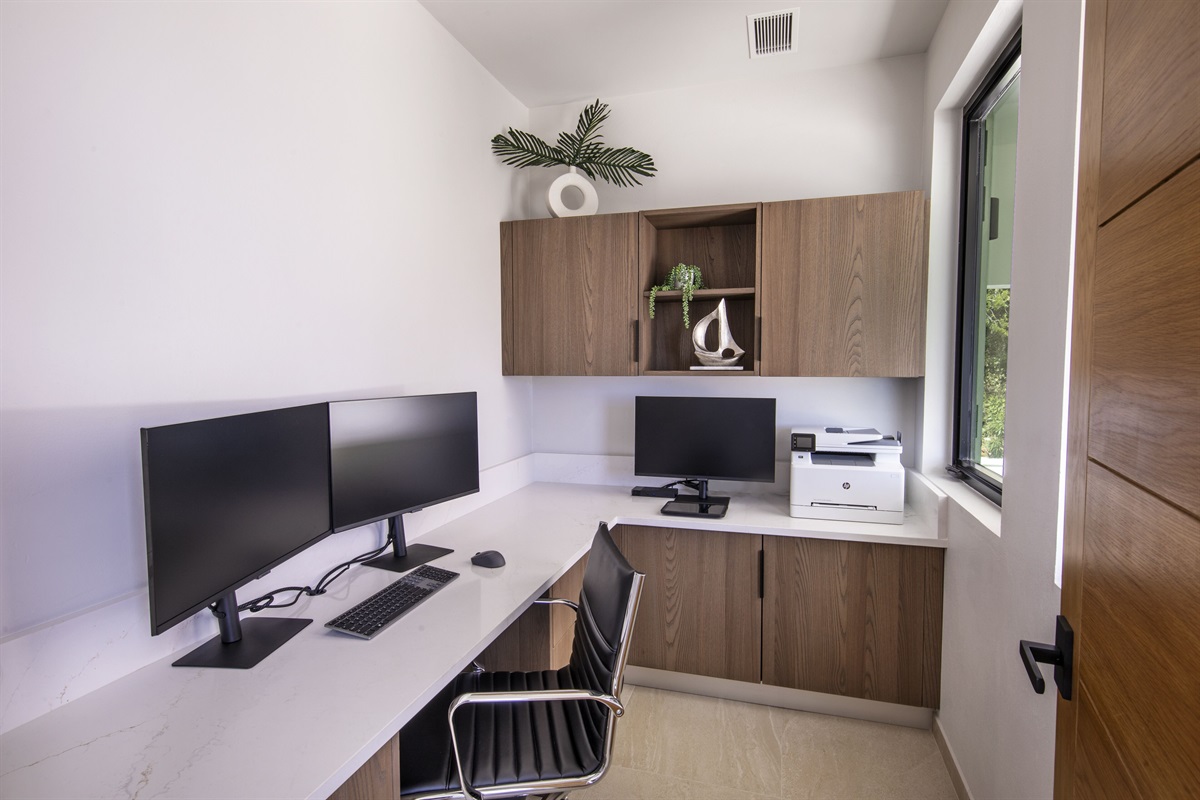 Office is located just off the kitchen area - has two monitors and printer access 