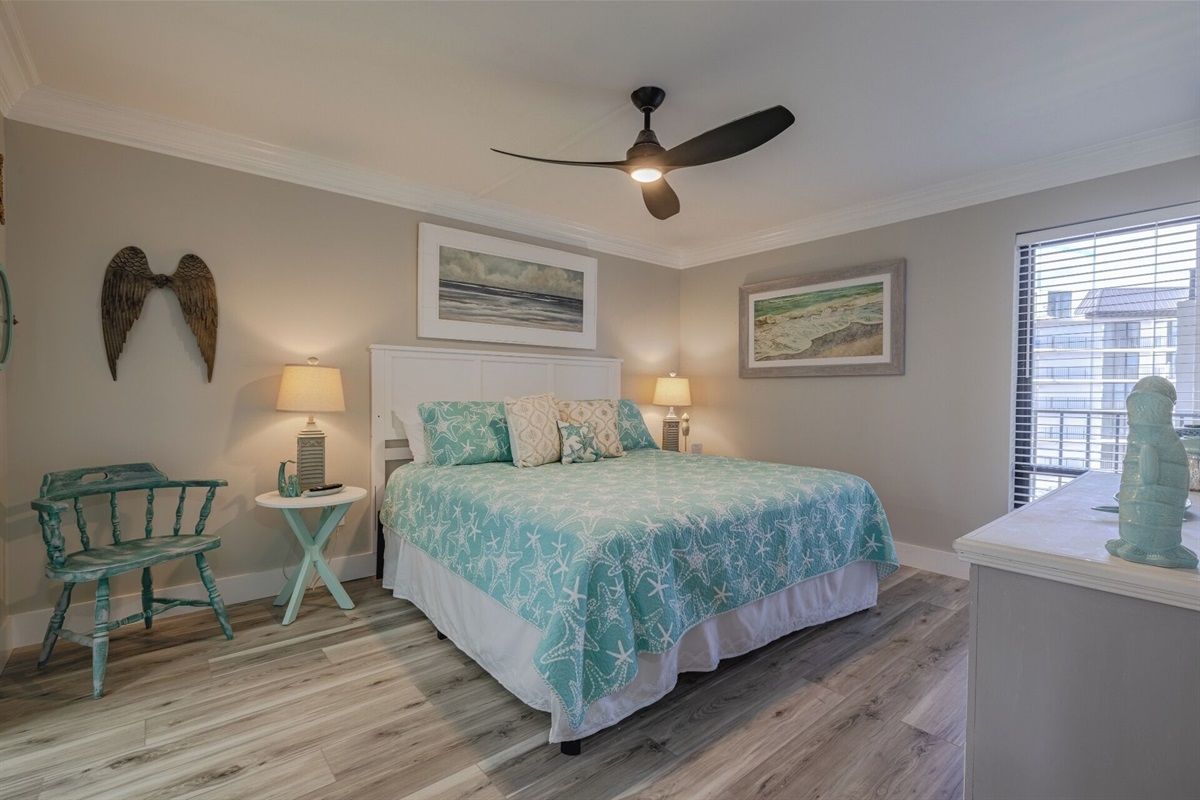 Master bedroom with king bed, ceiling fan, smart TV and ensuite bathroom