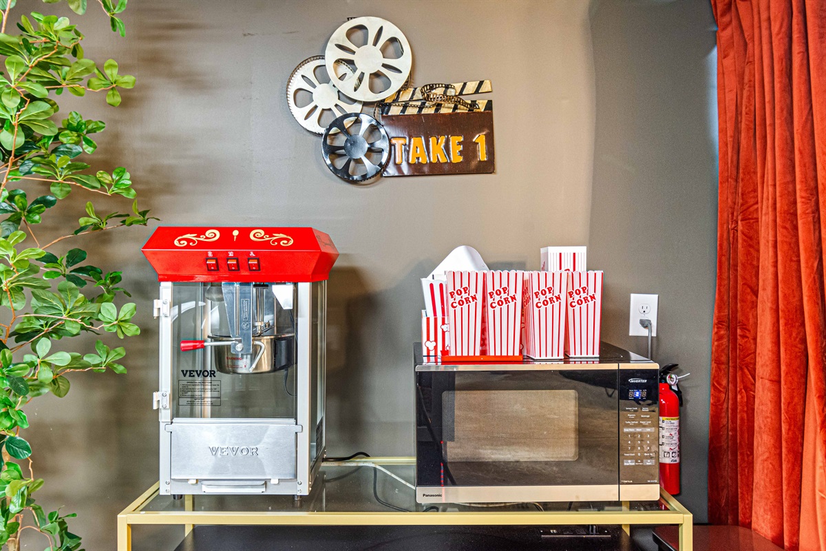 Pop, watch, repeat 🍿 — the in-house popcorn machine makes movie night extra fun!