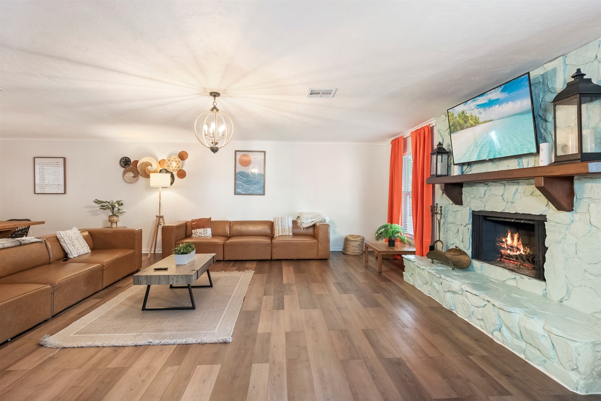 Newly decorated! Huge boho themed living room with 12-foot long custom dining table.