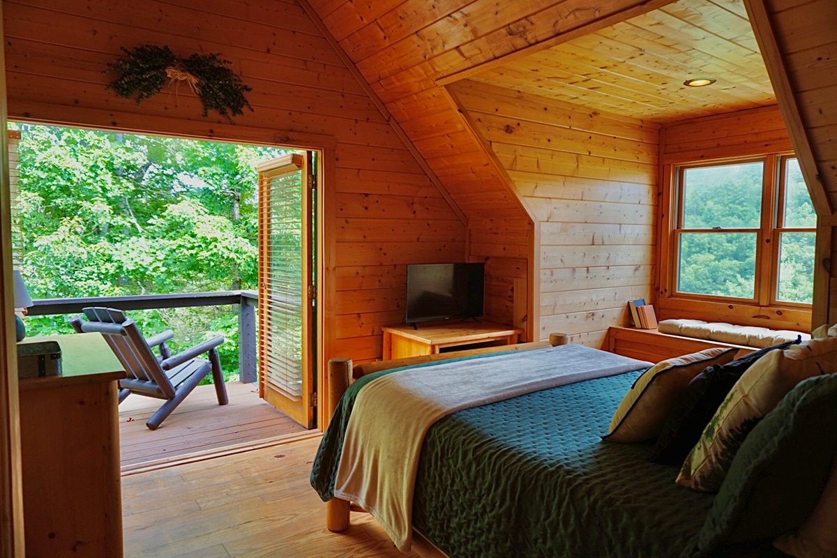 Charming Loft: Unwind in a tranquil space with stunning views and warm wood accents!