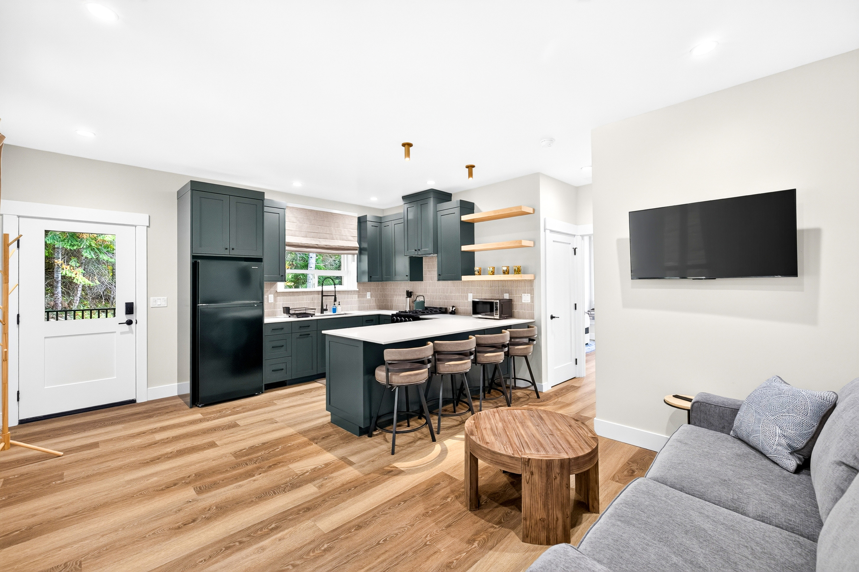 Prepare meals before you relax in this second fully stocked kitchen located upstairs just outside the second primary bedroom.