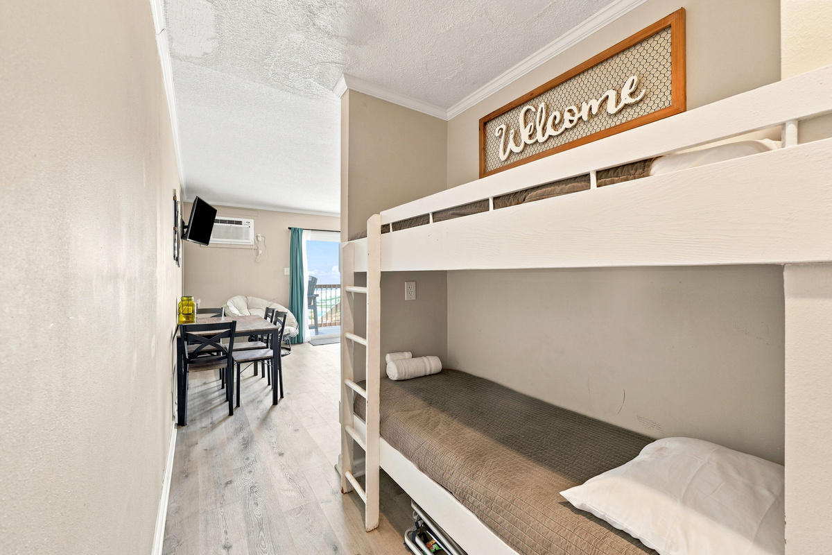 A cozy sleeping nook perfect for kids or additional guests, featuring a charming bunk bed setup and easy access to the main living area