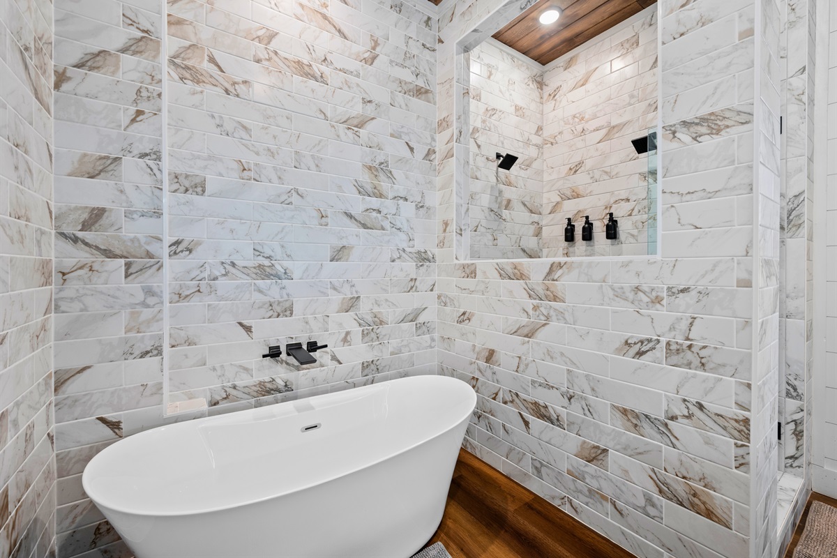 Ending the day with a soak feels extra luxurious in this gorgeous bathroom, complete with a deep tub and stylish tilework.