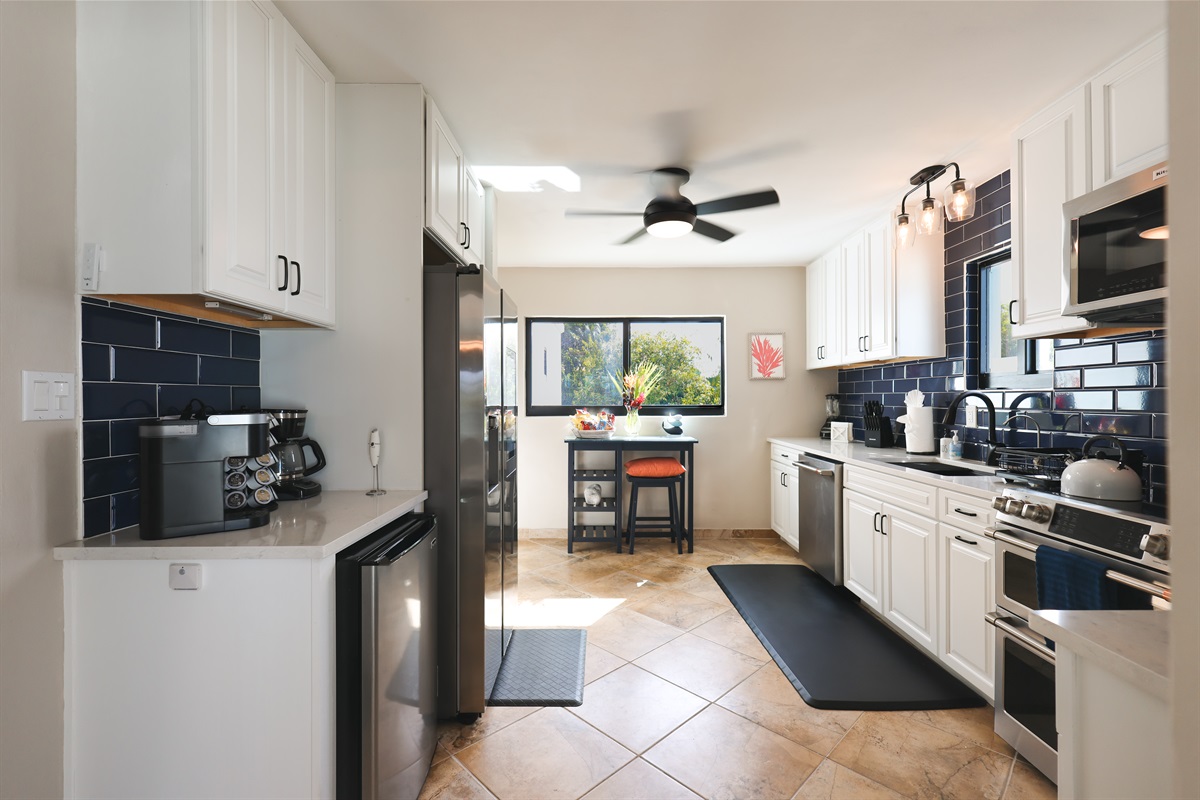 Gourmet kitchen featuring sleek countertops and modern appliances.