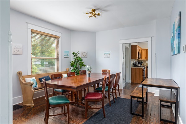 Share delicious meals together with plenty of seating for your whole group at the elegant wooden dining table and additional side table, complete with a high chair for little guests