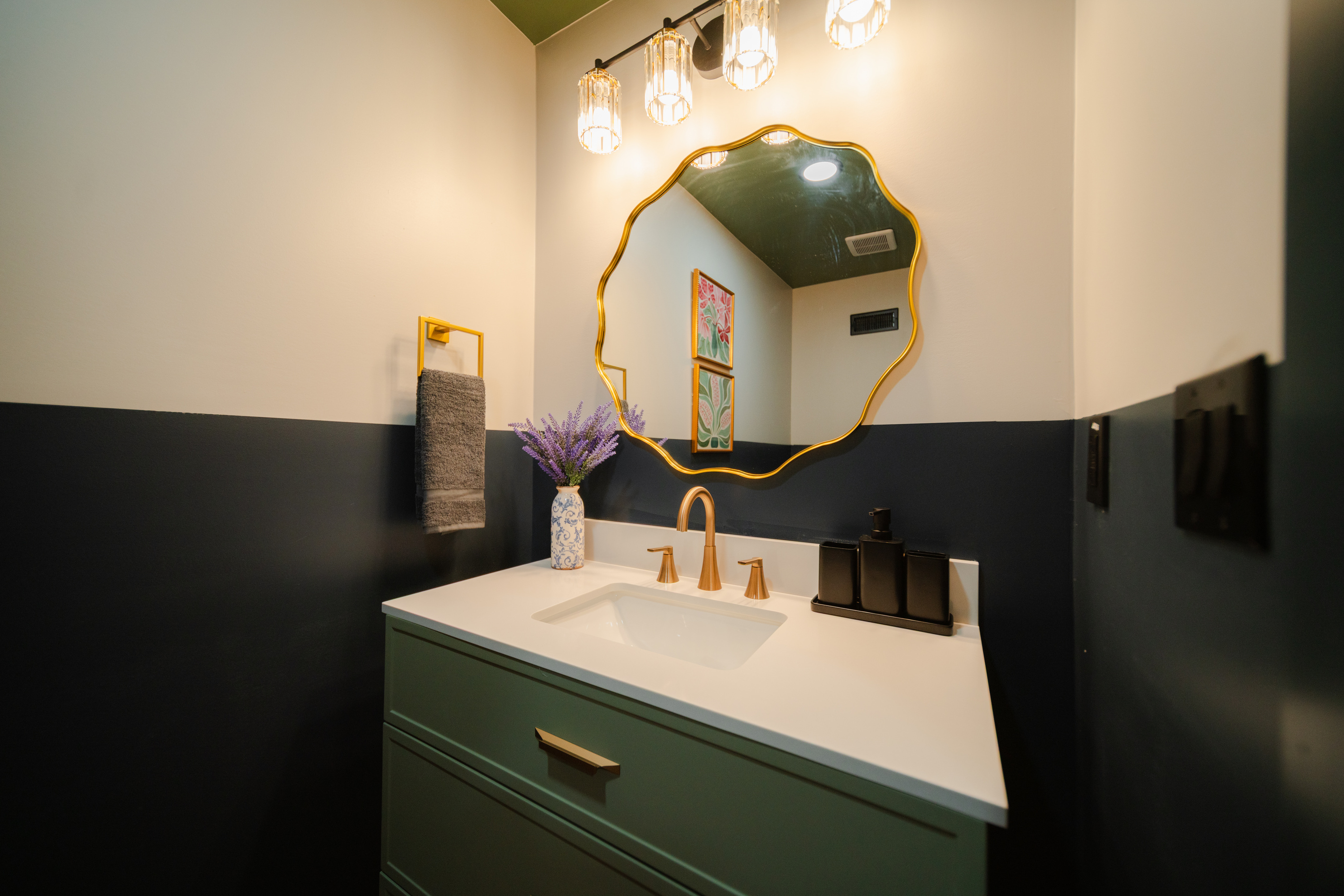 Lower-level entertainment lounge with a convenient half bath.