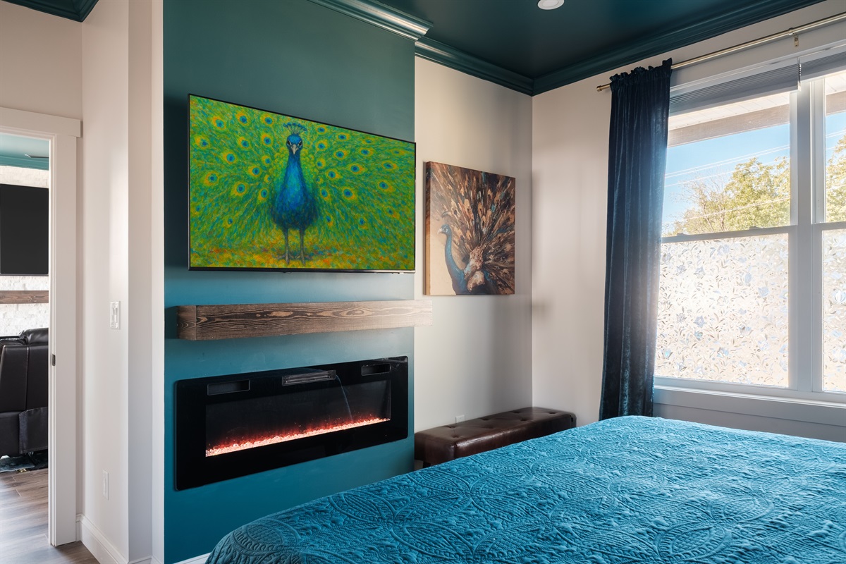 Enjoy a cozy night in watching your favorite shows on the Samsung Smart TV while the soft glow of the fireplace sets the perfect mood.