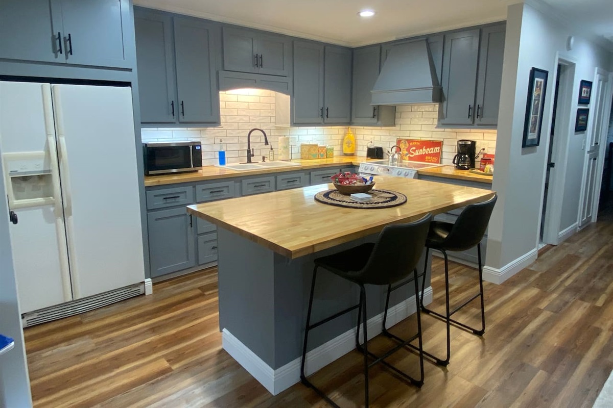 Beautiful kitchen with everything you need to cook a meal if you so choose. Coffee bar with all the fixings and snacks provided. 