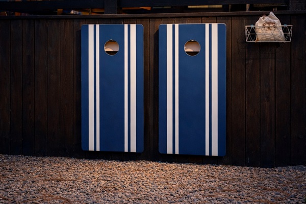 Play a game of corn hole