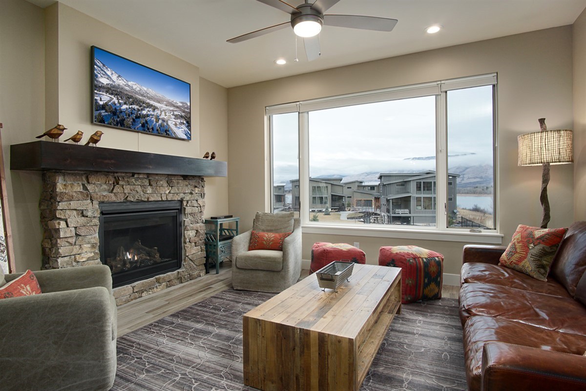 Inviting living area with stone fireplace, warm décor, and a perfect space to relax after a day outdoors.