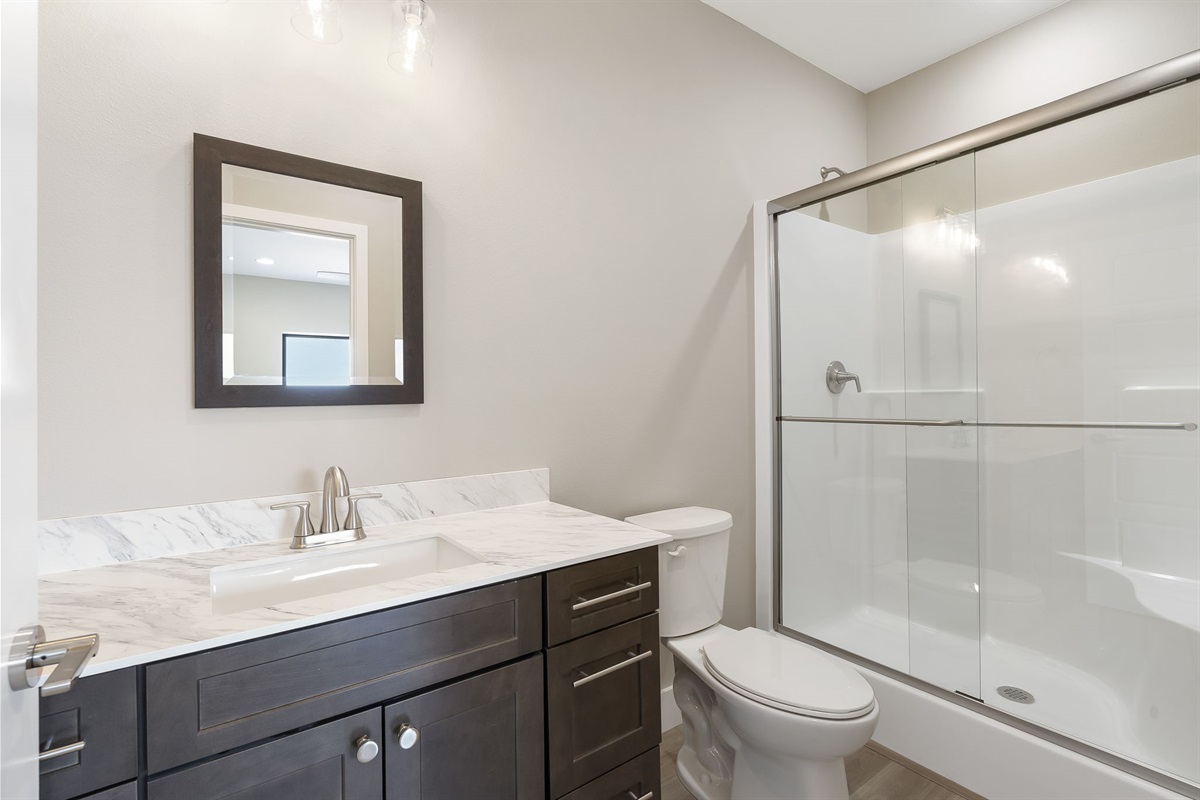 Main level master bedroom with en suite shower