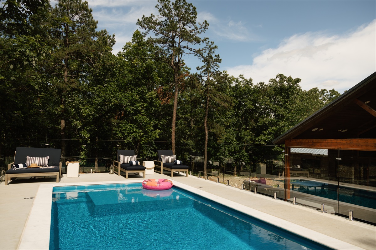 Your own secluded pool paradise tucked away in the woods.