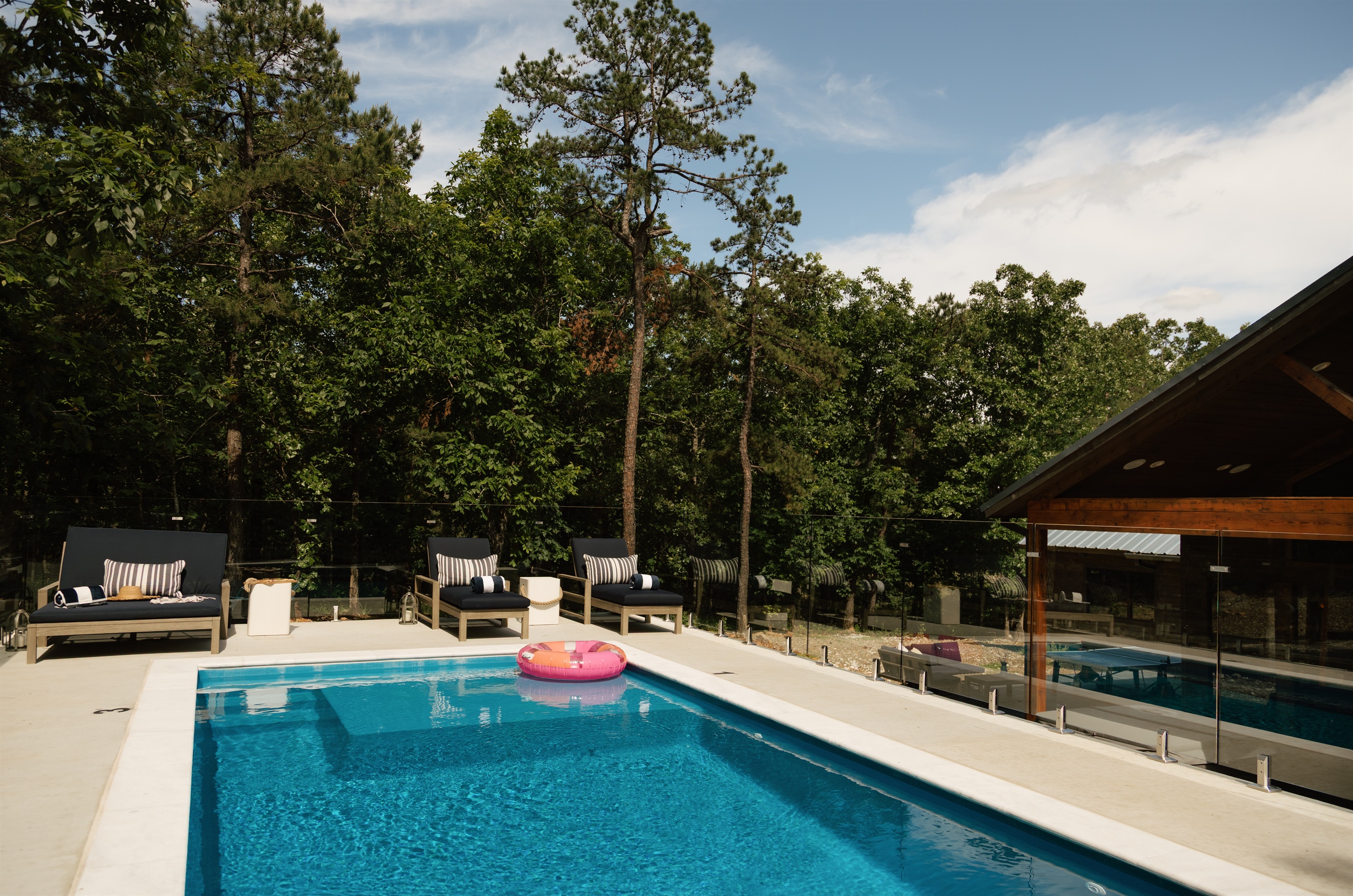 Your own secluded pool paradise tucked away in the woods.