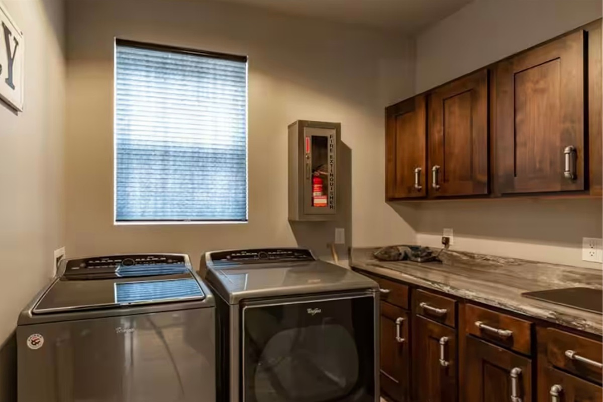 Laundry room with washer and dryer for longer stays.