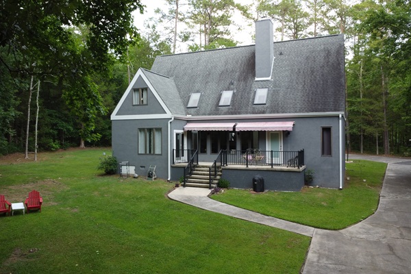 The back yard and back patio for hanging out, outdoor games, and fun!