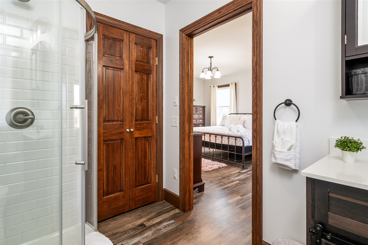 Freshly updated bath with walk-in shower and wood-trimmed charm.