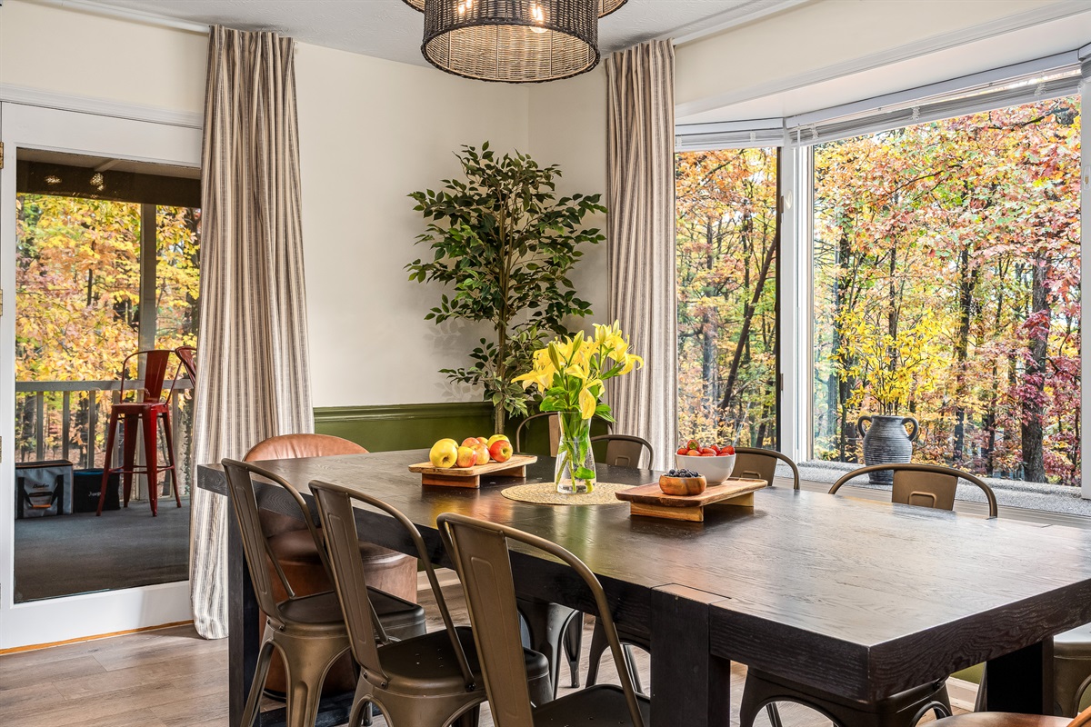 Meals taste better with a view. Gather around the table and enjoy the forest right outside the window.