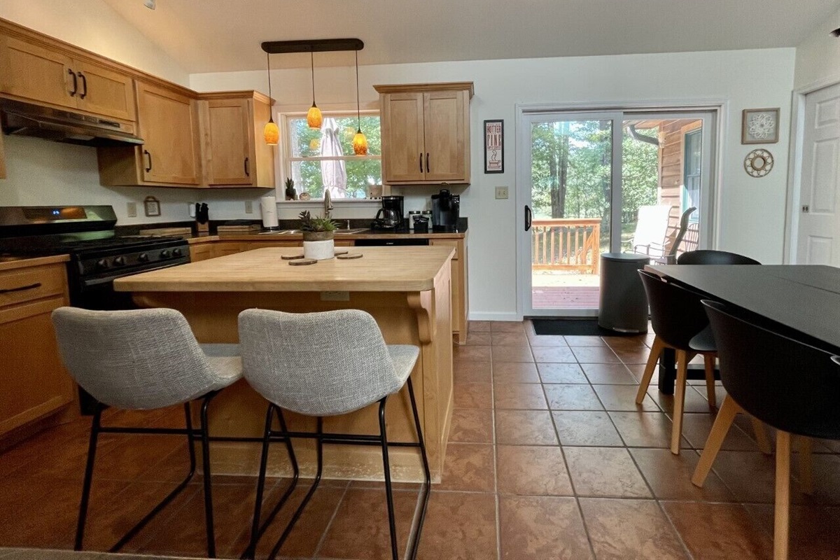 Breakfast bar seats two. Sliding doors to back porch