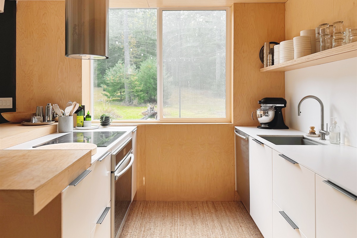 Kitchen with operable window overlooking the field
