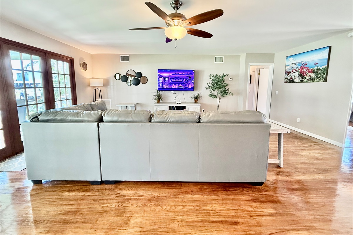 From the warm wood floors to the soft throw pillows, every detail in this living room invites you to sink in and stay a while.