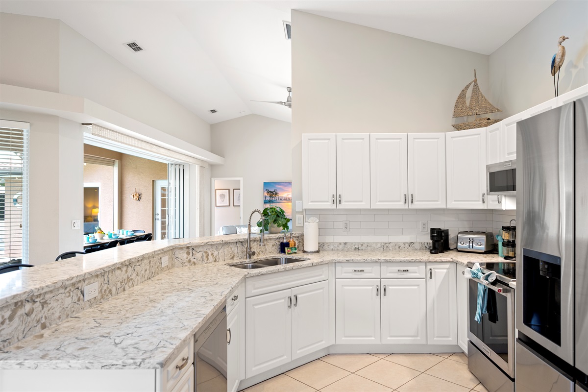 Whip up vacation favorites in this sparkling new kitchen with quartz counters