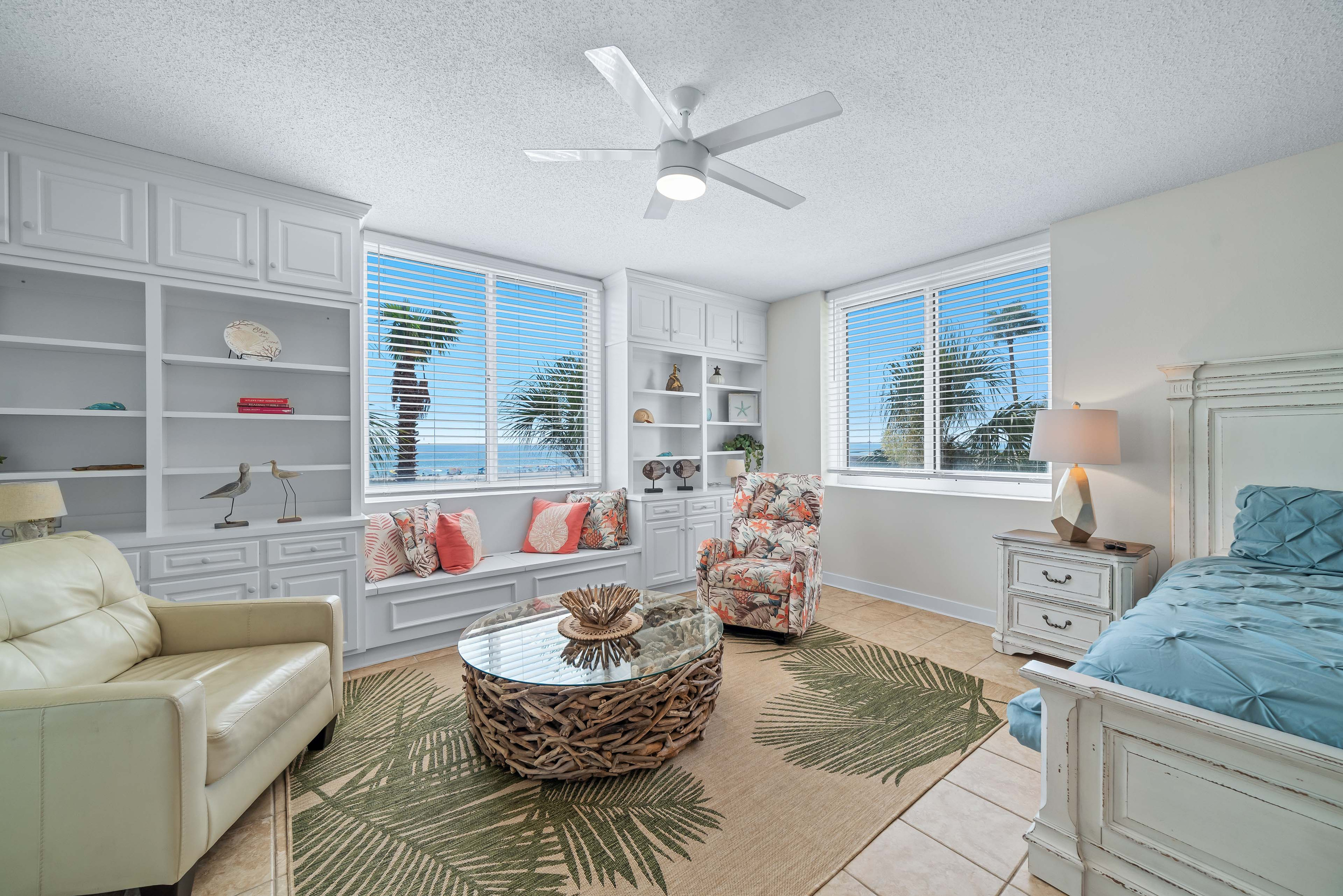 This bright and airy space offers a perfect spot for relaxation, with plush seating, a statement coffee table, and ample natural light in the Primary bedroom.