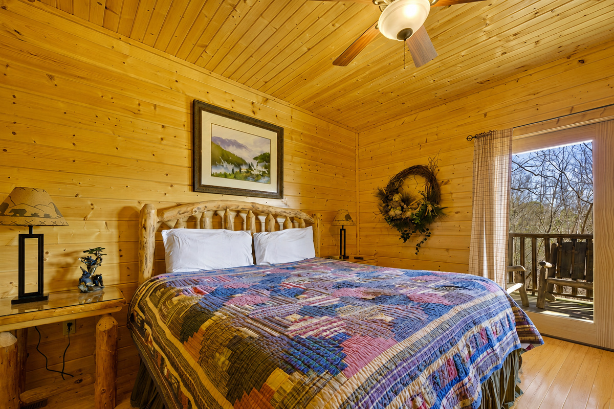 Bedroom #3 - Wake up to sunlight streaming through the windows and the peaceful rustle of the trees. This inviting bedroom blends rustic charm and comfort for a truly restful escape.